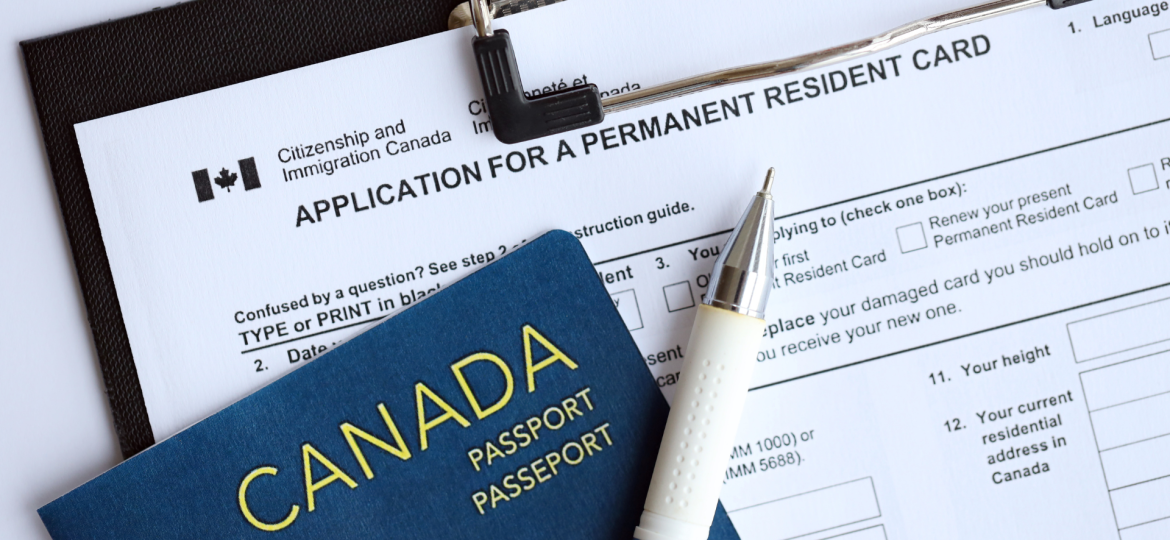 Canadian passport next to an application for a resident permanent